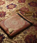 Rich red fabric with elegant embellished ethnic design